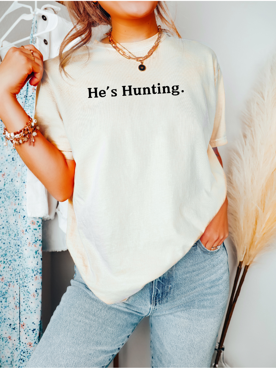 HE'S HUNTING. - ADULT TEE