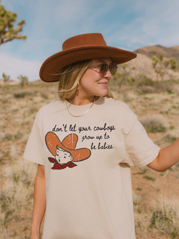 MAMAS DONT LET YOUR COWBOYS GROW UP TO BE BABIES (P) - Adult Tee