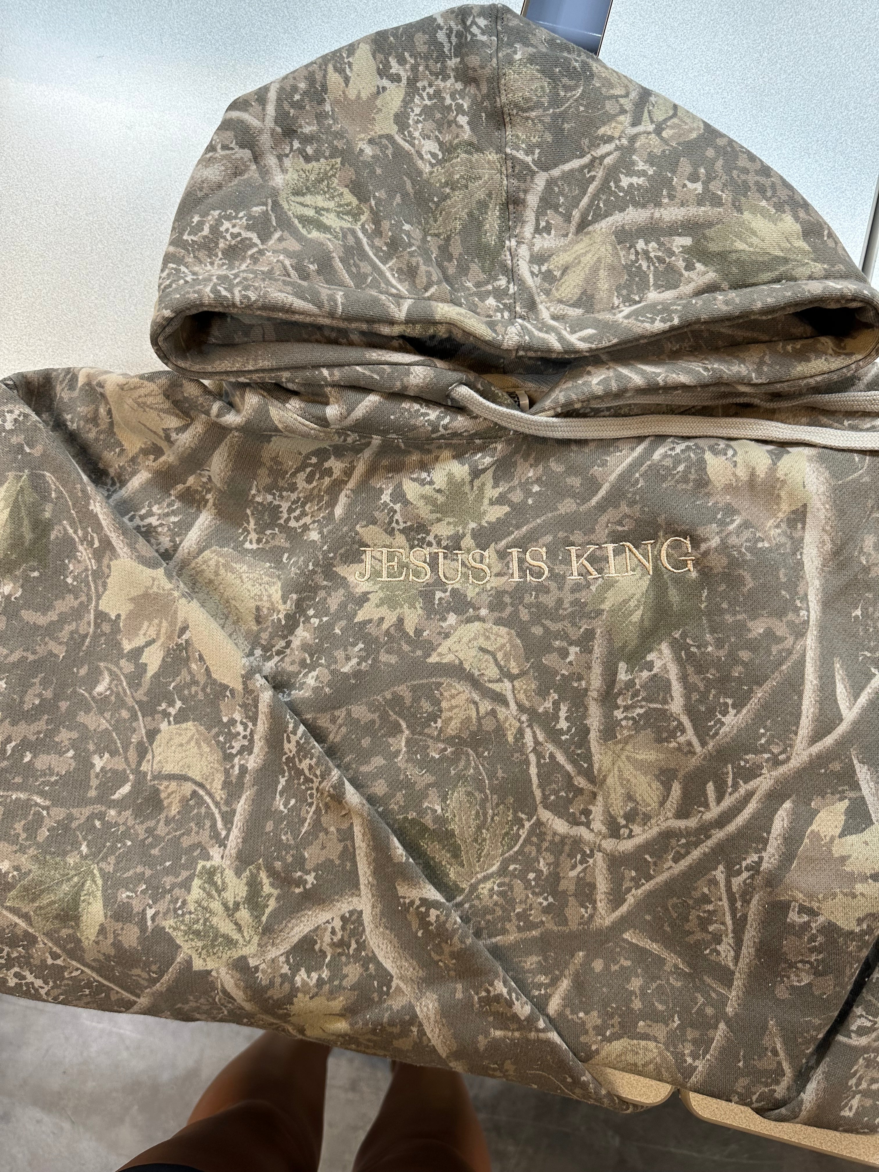 JESUS IS KING CAMO HOODED SWEATER