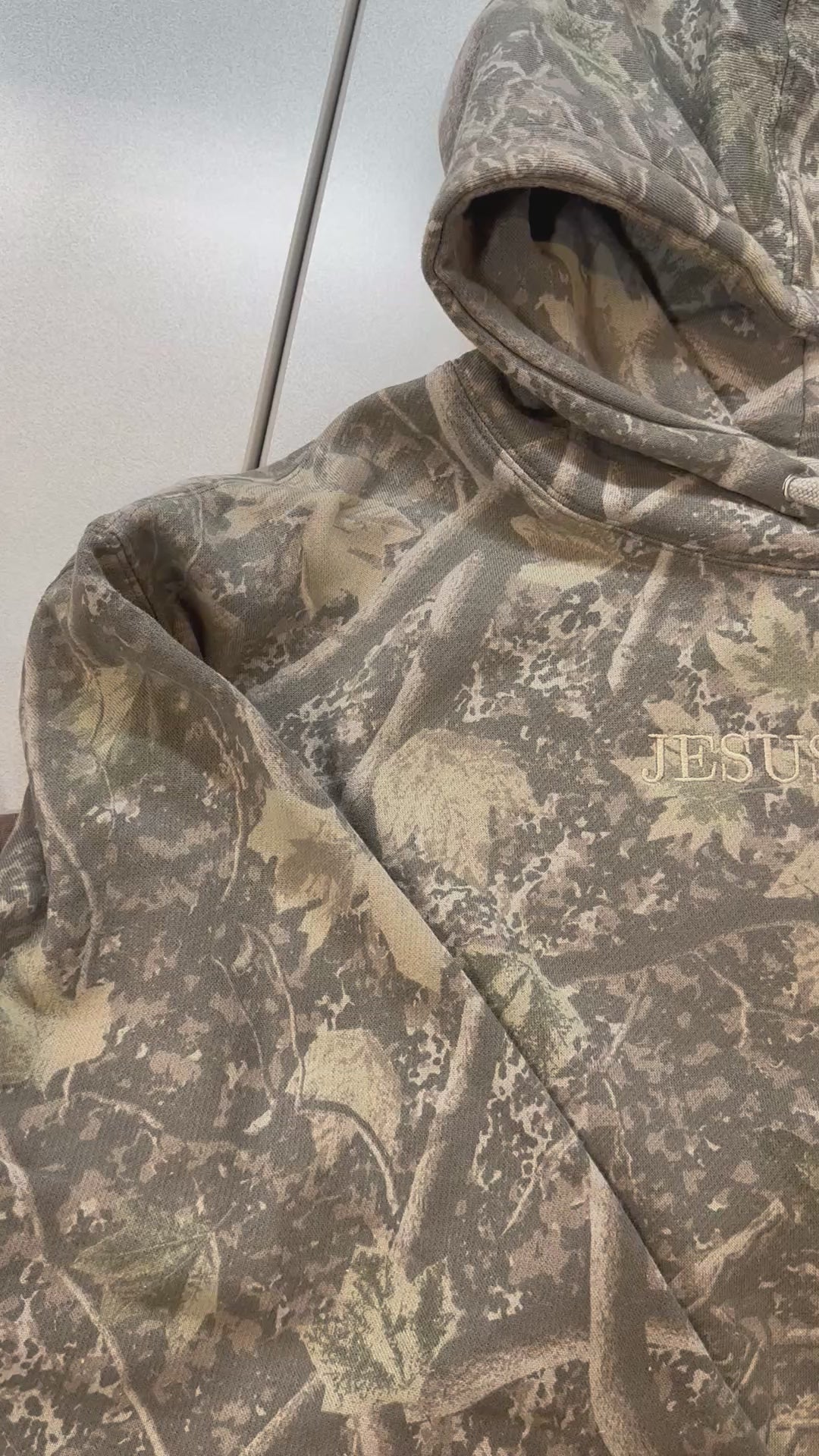 Load video: JESUS IS KING CAMO HOODED SWEATER